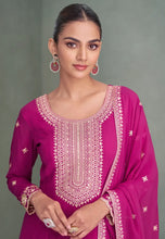 Load image into Gallery viewer, Woman wearing a pink embroidered traditional outfit