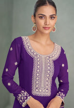 Load image into Gallery viewer, Woman wearing a purple embroidered outfit 

