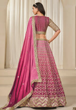 Load image into Gallery viewer, Fashneo pink and gold lehenga choli with intricate embroidery and matching dupatta from back view
