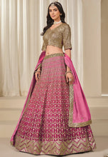 Load image into Gallery viewer, Fashneo pink and gold lehenga choli with intricate embroidery and matching dupatta worn by model
