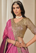 Load image into Gallery viewer, Fashneo pink and gold lehenga choli with intricate gold embroidery and matching accessories

