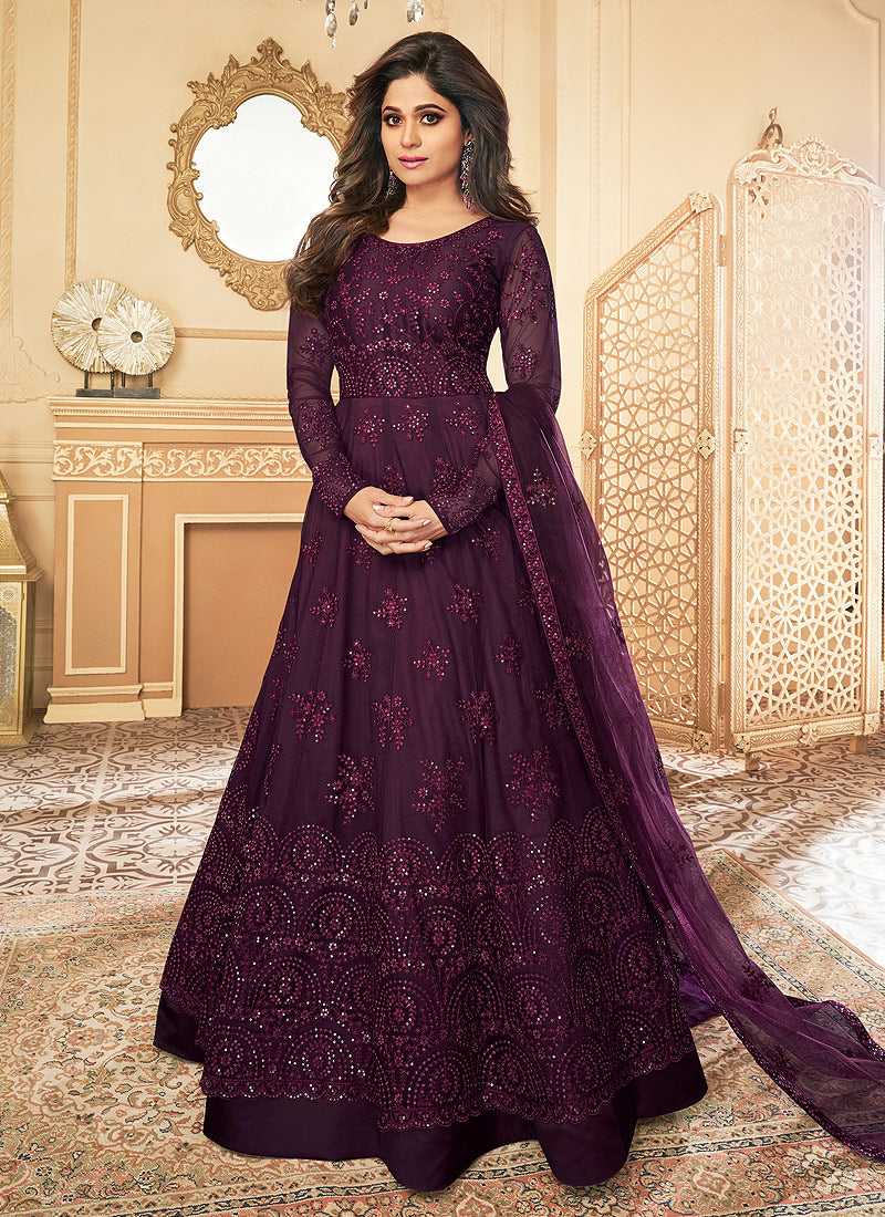 dark purple anarkali dress Embrace festive elegance this Diwali with this stunning deep purple Anarkali dress. Featuring intricate silver embroidery and delicate embellishments, this dress is perfect for adding a touch of tradition and style to