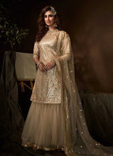 Load image into Gallery viewer, Dusky Beige Sequins Work Embroidered Gharara Style Suit fashionandstylish.myshopify.com

